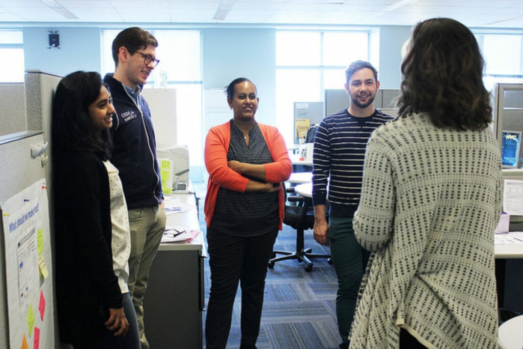 Code for America's New York fellows meet with city officials.