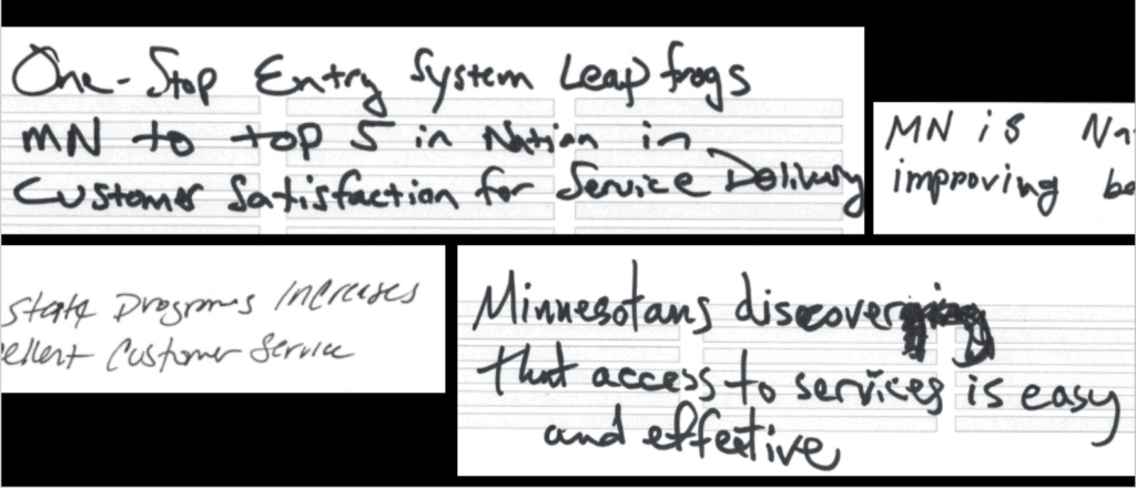 text written on index card showing goals for an improve benefits site