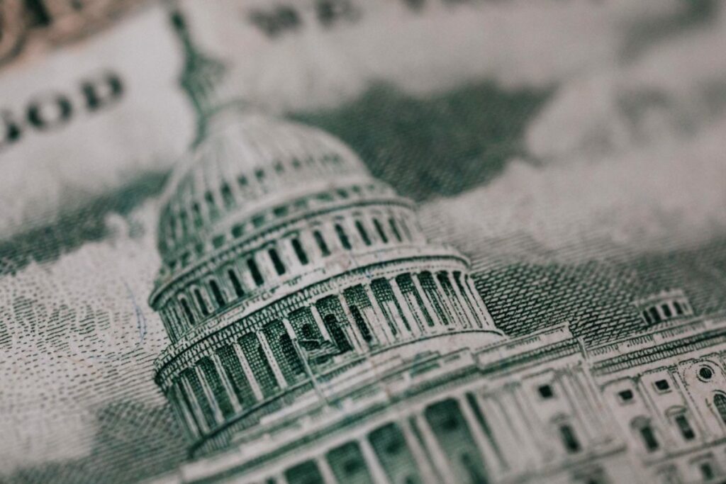 a close up of the U.S. Capitol building on the back of currency