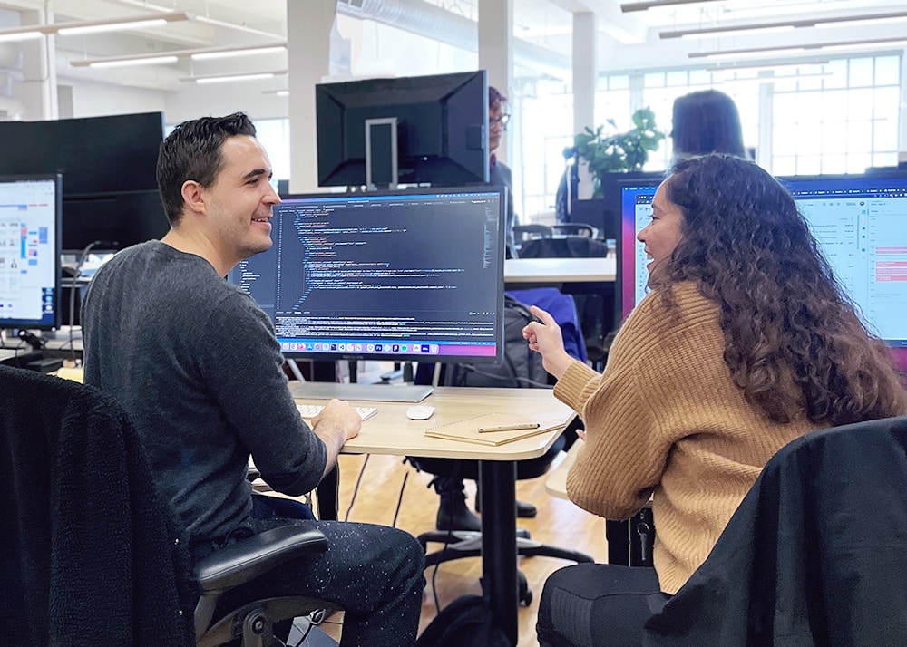 Two people talking in an office