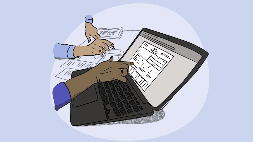 a computer with forms next to it