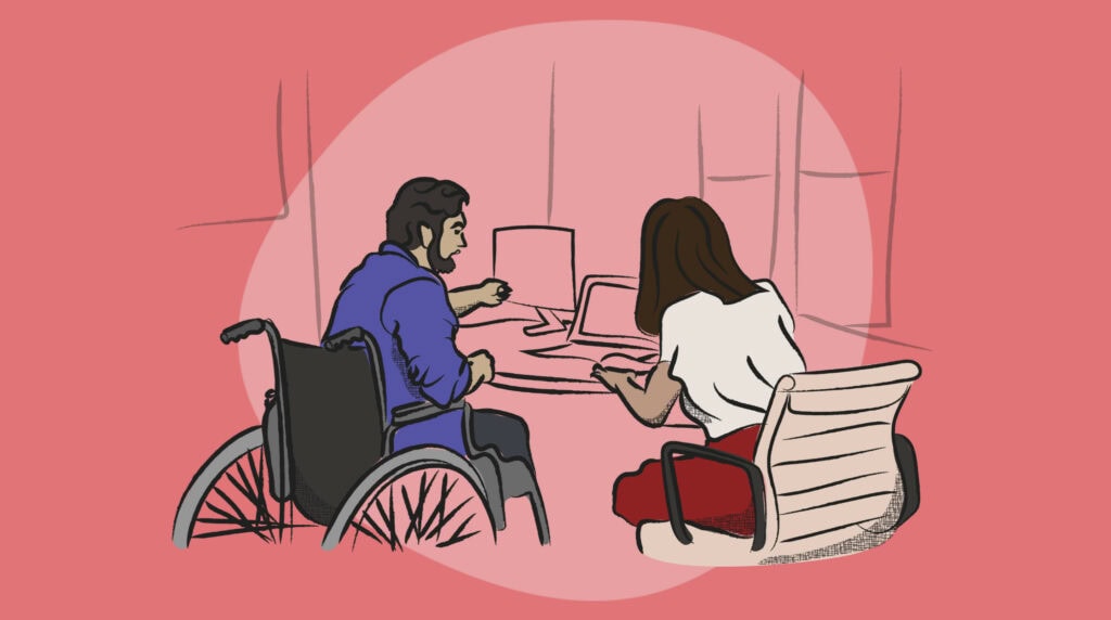 two people working at a computer